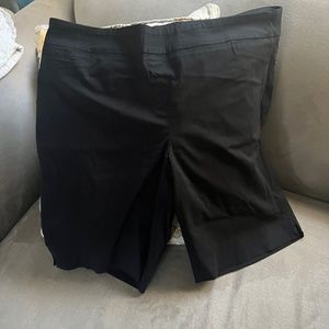 Black shorts. Pull on. Stretch. Faux pockets.